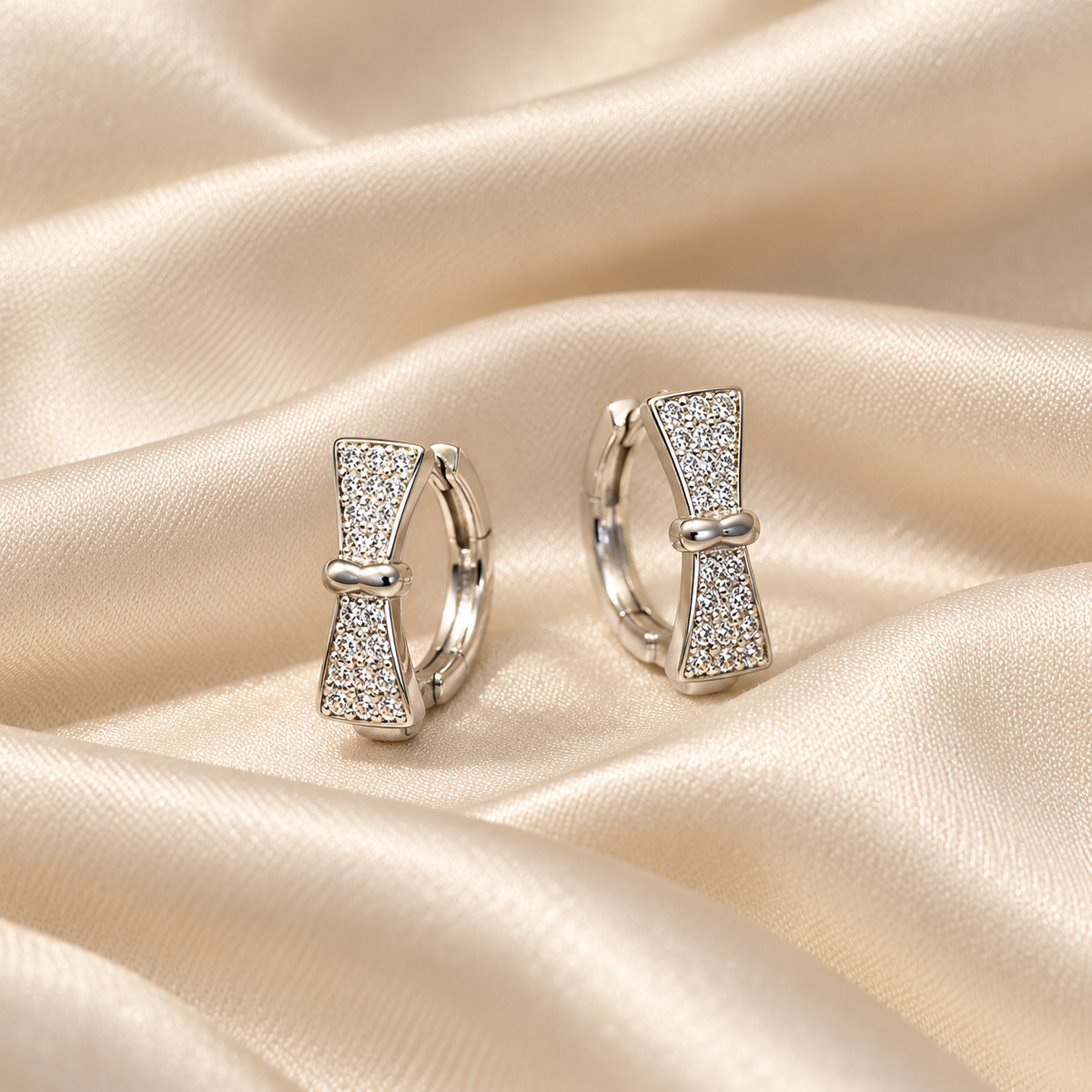 Silver Bow Huggie Earrings