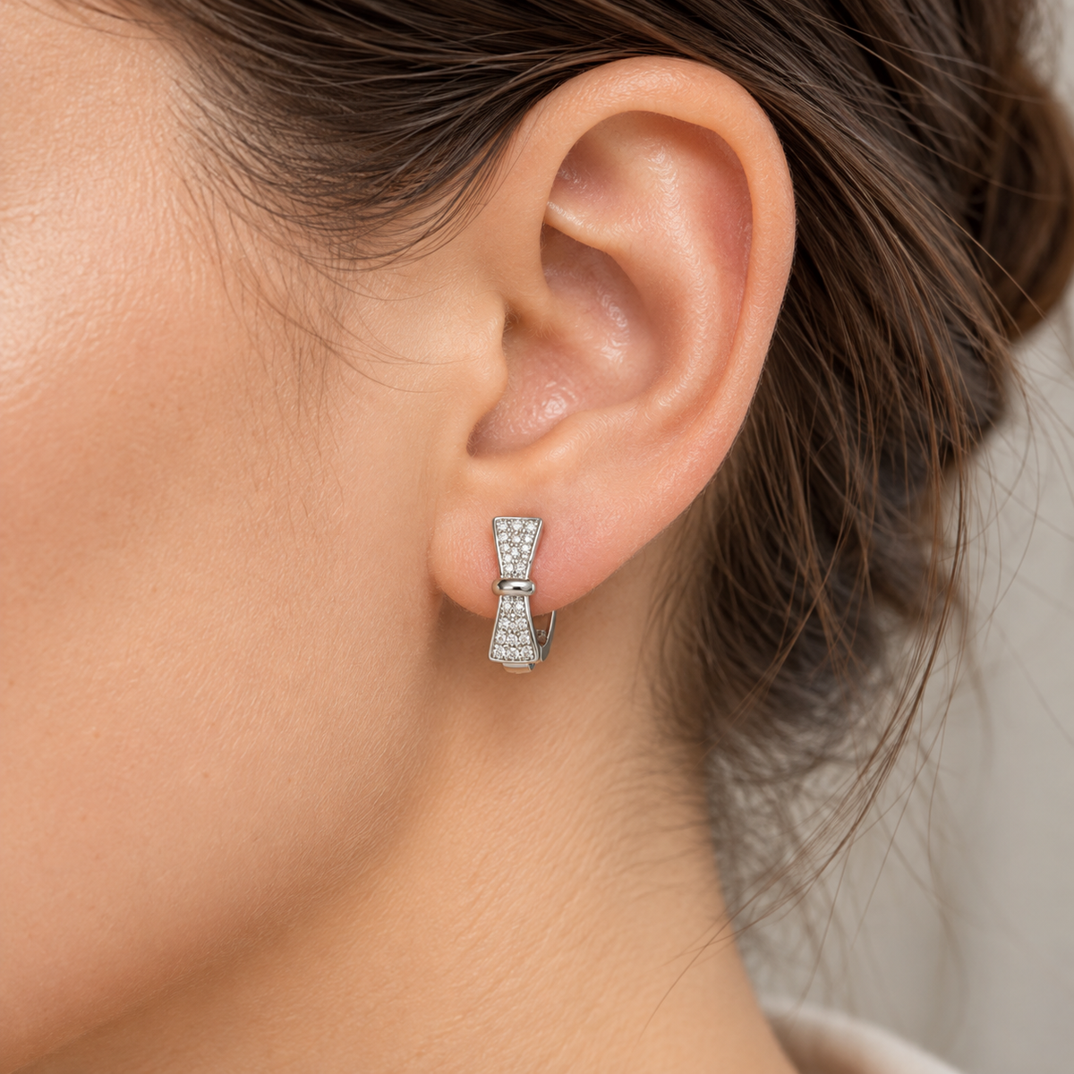 Silver Bow Huggie Earrings